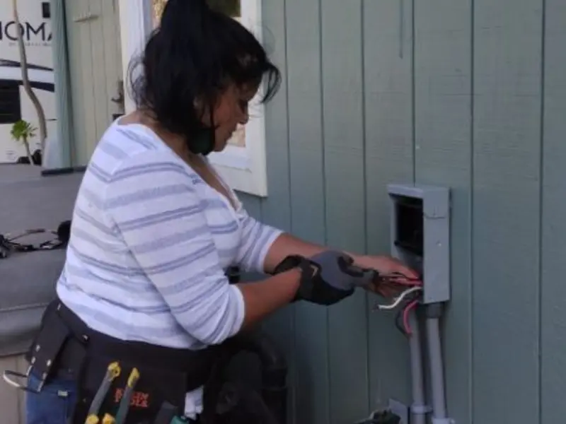 Licensed electrician wiring an exterior subpanel in Corbin